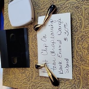 Monet black enamel and gold tone clip on earrings